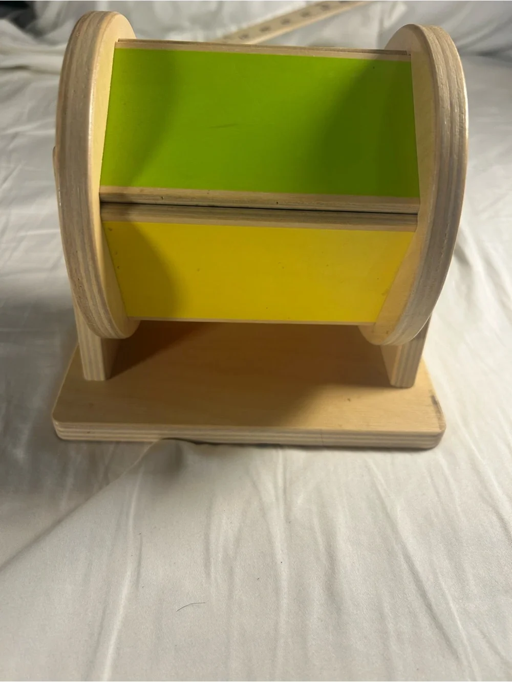 Lovevery Wooden Rotating Toy with Orange and Red Panels